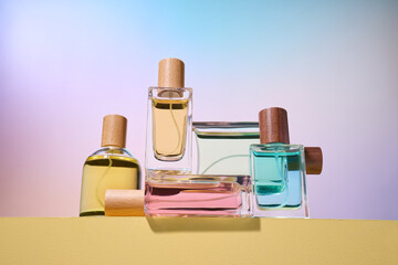 Elegant perfume bottles with colored liquids and wooden caps