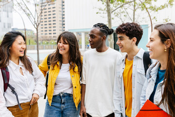 Young group of teenage students hanging out at high school campus. Youth community and education lifestyle concept