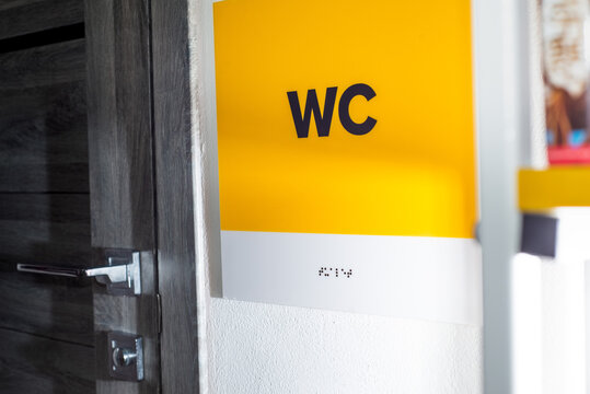 WC sign written in braille