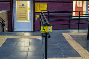 Wheelchair ramp and emergency button for people with disabilities