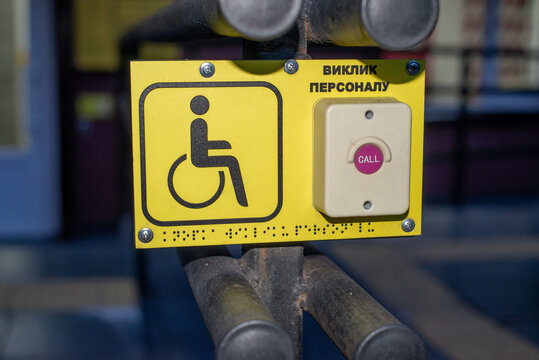 Sign with Braille and emergency button for people with disabilities