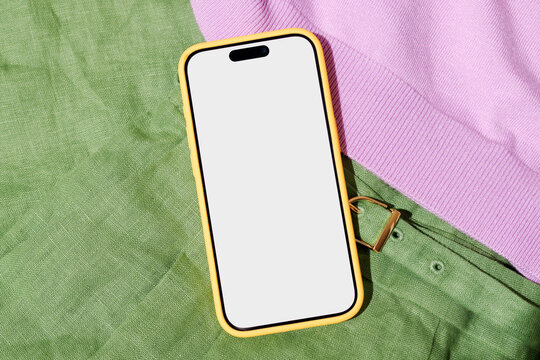 Mockup Phone with white screen on Green and Purple Cloth