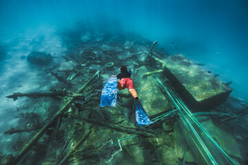 Diver Exploring a Sunken Wreck
