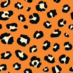 Fototapeta premium Leopard print pattern with black and beige spots on an orange background, creating a bold and exotic design