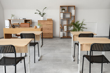 Interior of modern empty classroom prepared for exam