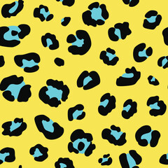 Fototapeta premium Leopard print pattern with black and blue spots on a yellow background