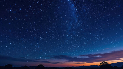 山の向こうに見える星空と天の川、夜景