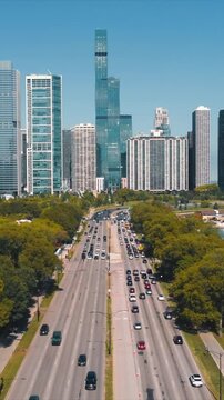 Scenic view of Chicago lakefront S Dusable Lk Shr Dr. The central highway is loaded with traffic.