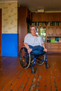 Portrait of a woman in a wheelchair.