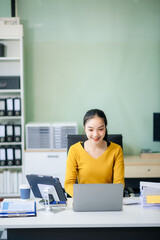  Asian female office worker business suits smiling at camera with working notepad, tablet and...