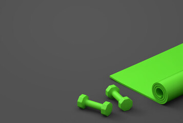 Vivid green fitness mat and dumbbells isolated on dark gray background. Clipping path included