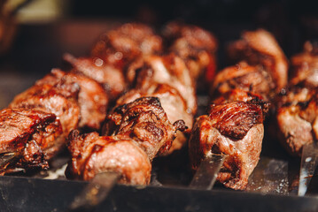 grilled shish kebab on skewers, close-up view, fried meat, delicious food