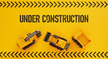 Web site under construction. Coming soon is shown using the text with a loading bar