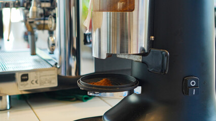 Barista make a coffee with coffee machine