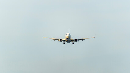 A plane in the sky during take -off or landing