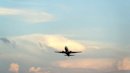 A plane in the sky during take -off or landing
