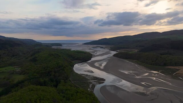 Afon Mawddach Estuary Tidal Channels and Mudflats in Snowdonia National Park Wales during sunset
