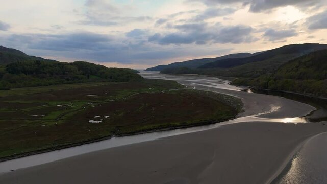 Afon Mawddach Estuary Tidal Channels and Mudflats in Snowdonia National Park Wales during sunset