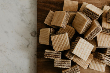 Chocolate Wafers on Wooden Board and Marble Counter