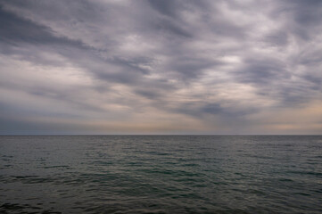 Ocean with sky in horizon. Calm sea in evening. Seascape at sunset.