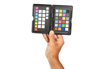 Male hand holding a color checker isolated no background cutout