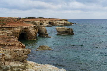 Beautiful rocky coastline in Peyia, Cyprus, with crystal clear waters of Mediterranean Sea....