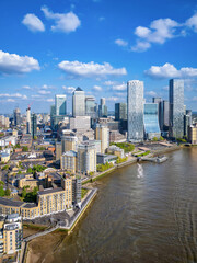 Aerial view of the financial district Canary Wharf and the Docklands in London, England, during a sunny day