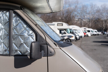 Obraz premium Motorhomes parked in a city parking lot