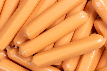 Heap of chicken vienna sausage wrapped in plastic. Close up