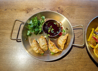 Trying national Asian cuisine in a restaurant