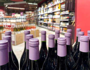 defocused alcohol (wine, champagne, liquor, whiskey) on store shelves