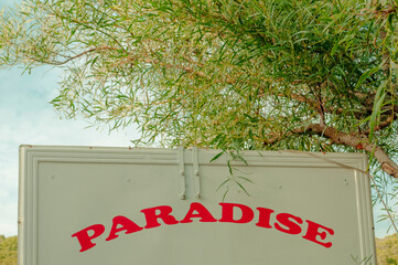 paradise sign on the back of a lorry
