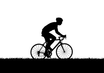 Naklejka premium Silhouette of Cyclist Riding Road Bicycle on Grassy Landscape