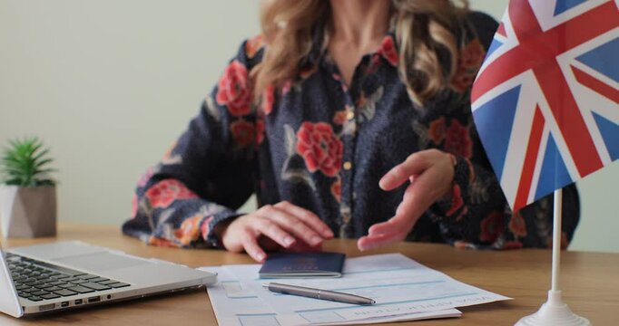 British embassy woman officer giving passport to man immigrant, student visa approval, work visa, citizenship. Visa Application online form immigration concept. Visa approval.