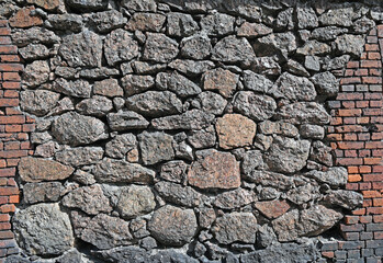 A wall of small stones close up