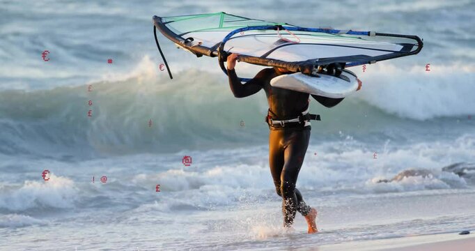 man carrying windsurfing rig walking shore showing floating speed gauge and chart for technology