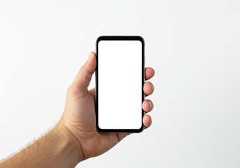 Hand holding a modern smartphone with a blank white screen against a plain studio background, ready for content