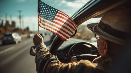 Senior Caucasian man in a car, holding an American flag out the window. Patriotic road trip vibes.
