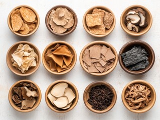 Fototapeta premium Assorted Dried Ingredients for Cooking in Wooden Bowls on a Light Background for Culinary Creations