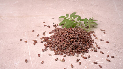 Brown flax seed or linseed on wooden background. Diet healthcare healthy food.