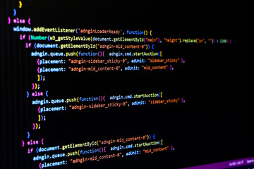 Software source code. Programming code. Programming code on computer screen. Developer working on...