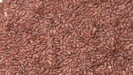 Brown flax seed or linseed on wooden background. Diet healthcare healthy food.