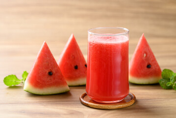 Fresh watermelon juice in glass on wooden background, Summer drink