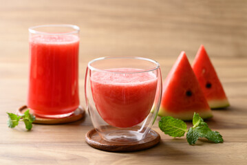 Fresh watermelon juice in glass on wooden background, Summer drink