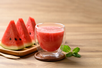 Fresh watermelon juice in glass on wooden background, Summer drink