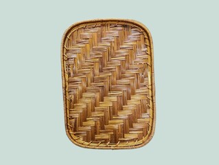 The light green background in the picture is a pattern of brown rattan and bamboo weaving. It is a beautiful and delicate weaving pattern that can be used to weave baskets or various products.
