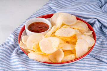 Crispy airy rice shrimp chips. Fragrant prawn crackers with sauce