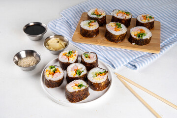 Traditional Korean food kimbap, with ham, vegetables and lettuce
