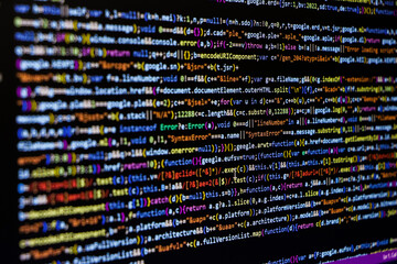 Software source code. Programming code. Programming code on computer screen. Developer working on...