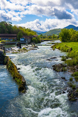 Salat River in front of the green mountains of the Couserans in spring from Saint-Lizier
